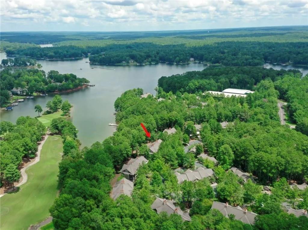 1060 Tailwater, Unit F Greensboro, GA 30642 - Photo 2 of 24 a view of a lake with a city