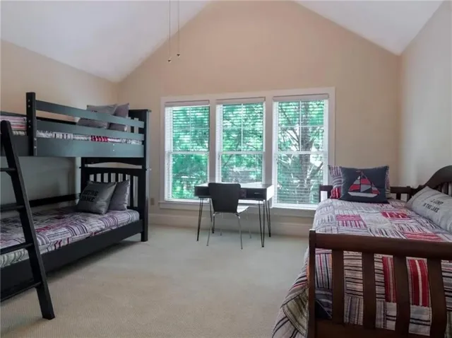 a bedroom with furniture and a window