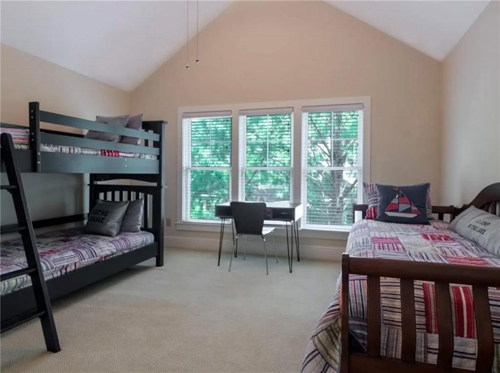 1060 Tailwater, Unit F Greensboro, GA 30642 - Photo 6 of 24 a bedroom with furniture and a window