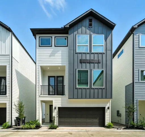 a front view of a house with glass windows