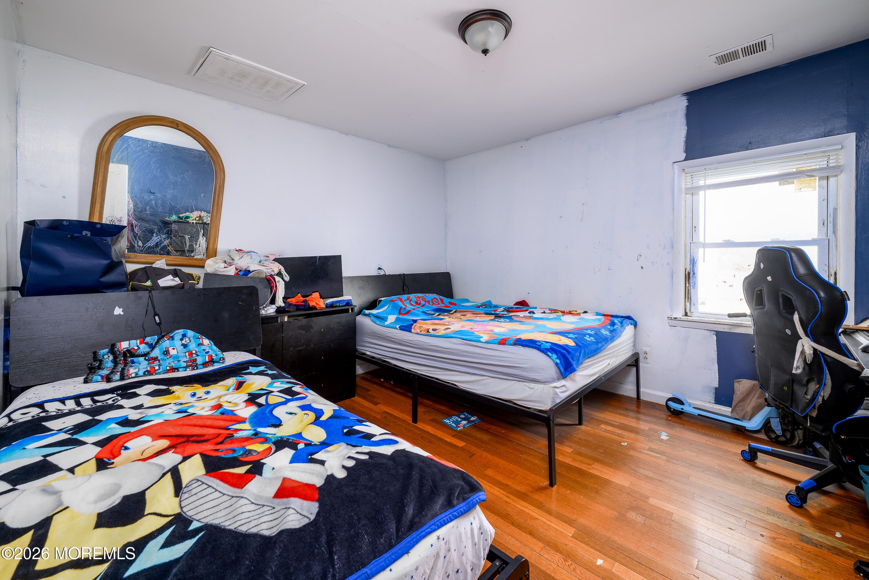 2nd Avenue, Unit 2 Long Branch, NJ 07740 - Photo 12 of 32 a bedroom with a bed and a dresser