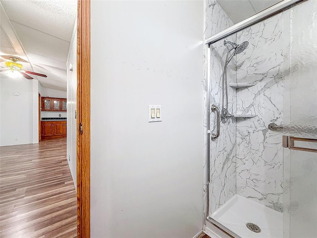 1819 Sinclair Hills Road Lutz, FL 33549 - Photo 44 of 60 a bathroom with a shower and a sink