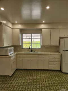 a bathroom with a sink a mirror and a bathtub