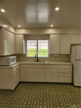 a bathroom with a sink a mirror and a bathtub