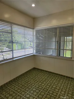 a bathroom with a bathtub and a window