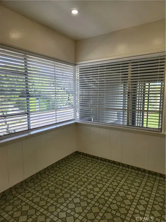 a bathroom with a bathtub and a window