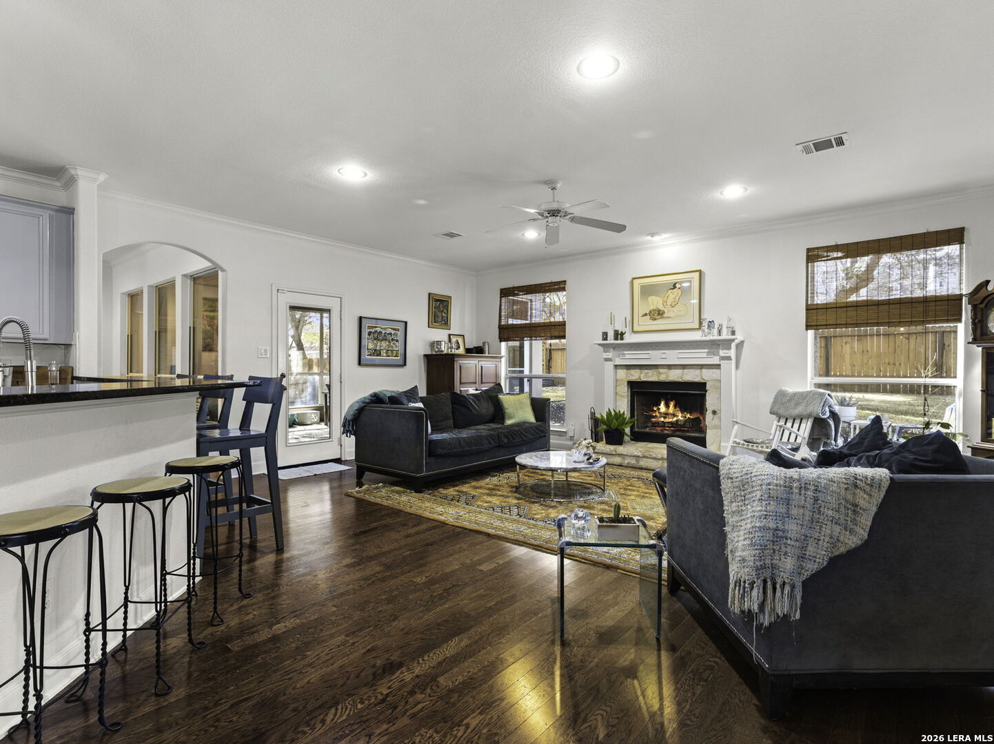 16107 La Madera Rio Helotes, TX 78023 - Photo 13 of 39 a living room with fireplace furniture and a wooden floor
