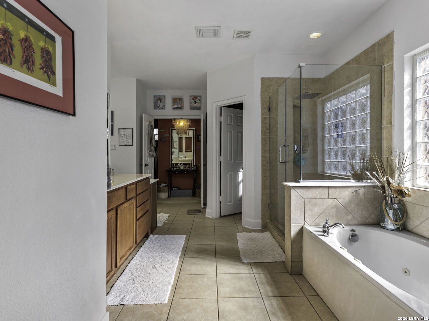 16107 La Madera Rio Helotes, TX 78023 - Photo 20 of 39 a bathroom with a bathtub and a shower