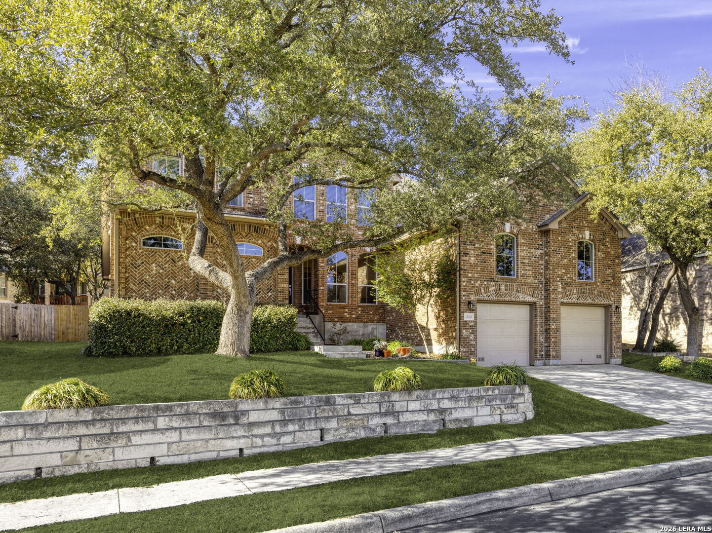 16107 La Madera Rio Helotes, TX 78023 - Photo 2 of 39 a front view of a house with a yard