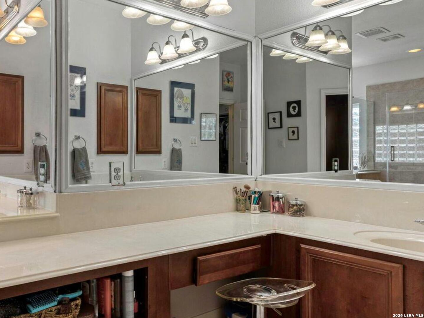 16107 La Madera Rio Helotes, TX 78023 - Photo 22 of 39 a bathroom with a sink and a mirror