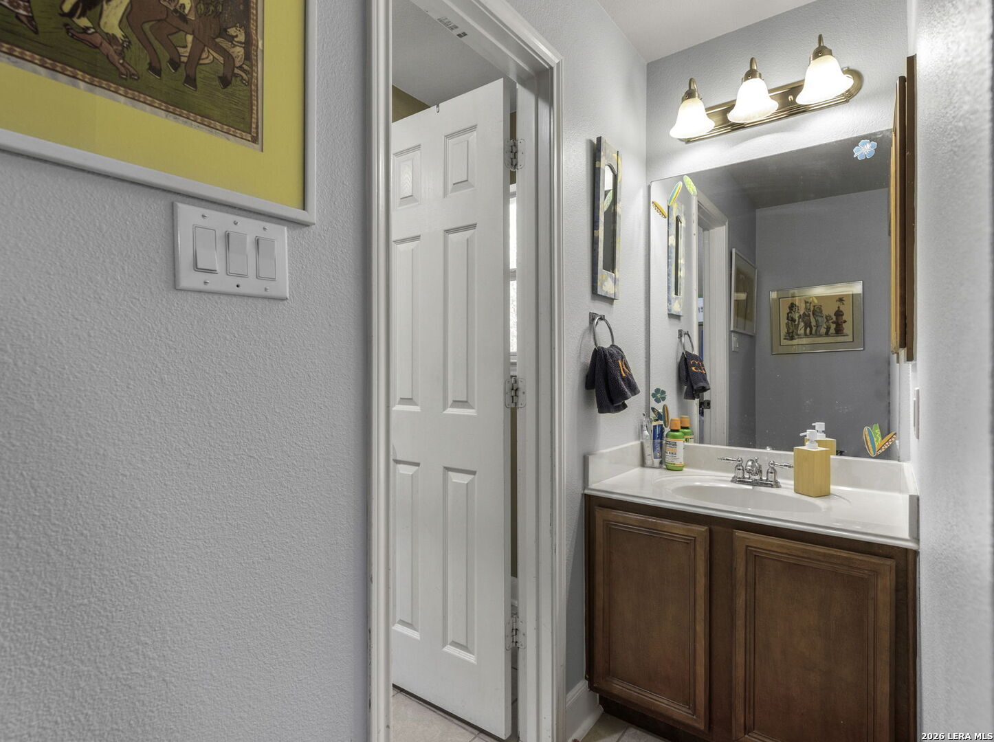 16107 La Madera Rio Helotes, TX 78023 - Photo 23 of 39 a bathroom with a sink and a mirror
