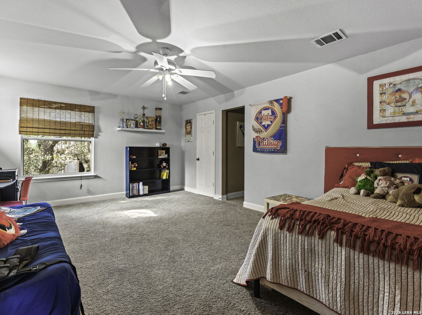 16107 La Madera Rio Helotes, TX 78023 - Photo 24 of 39 a bedroom with a bed and a chandelier