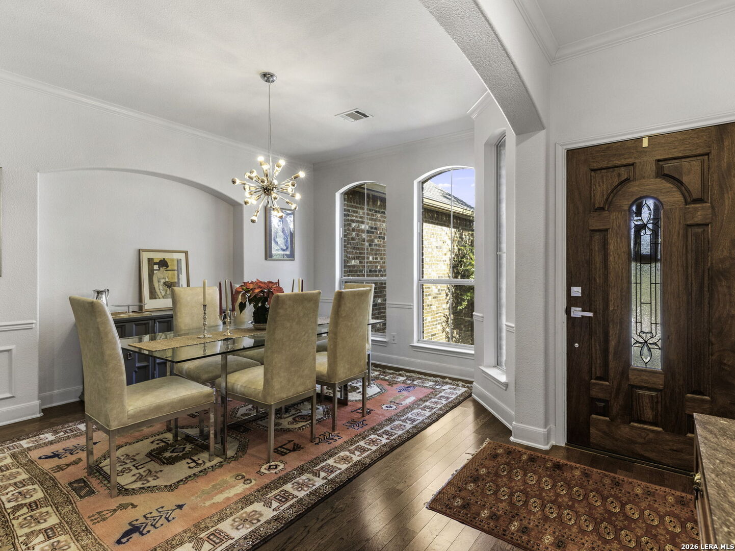 16107 La Madera Rio Helotes, TX 78023 - Photo 3 of 39 a view of a dining room with furniture and wooden floor