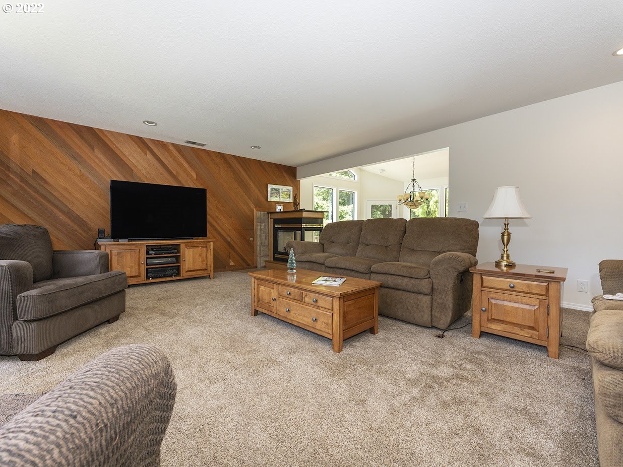 6562 South Zimmerman Road Aurora, OR 97002 - Photo 11 of 31 a living room with furniture and a flat screen tv