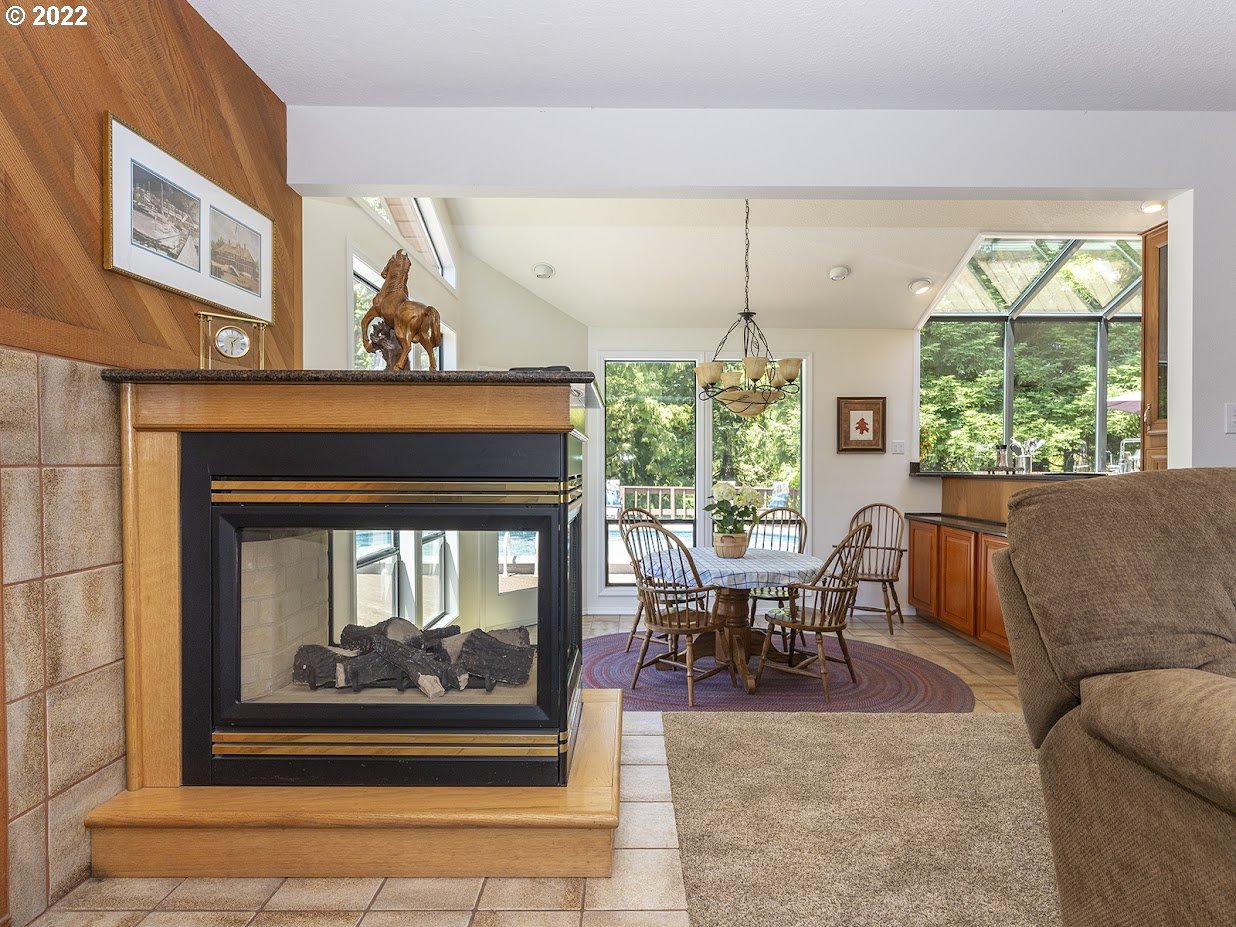 6562 South Zimmerman Road Aurora, OR 97002 - Photo 12 of 31 a living room with furniture and a fireplace