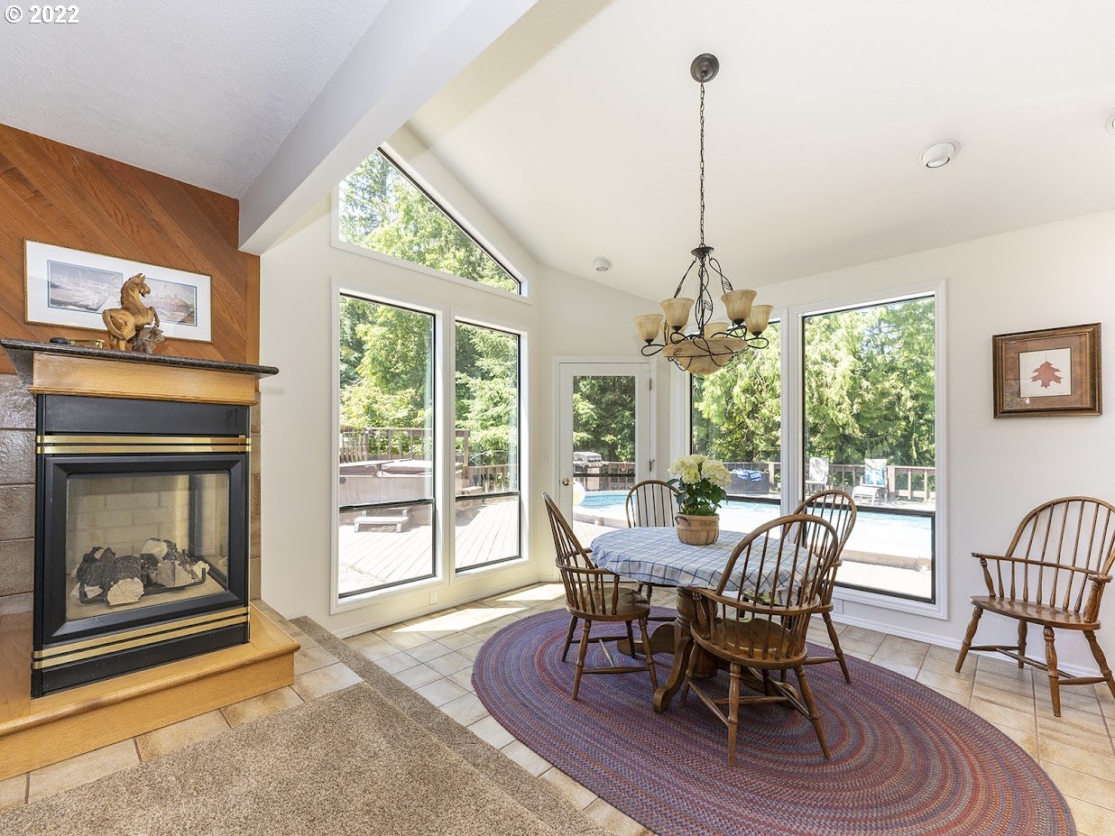 6562 South Zimmerman Road Aurora, OR 97002 - Photo 13 of 31 a view of a dining room with furniture window and wooden floor