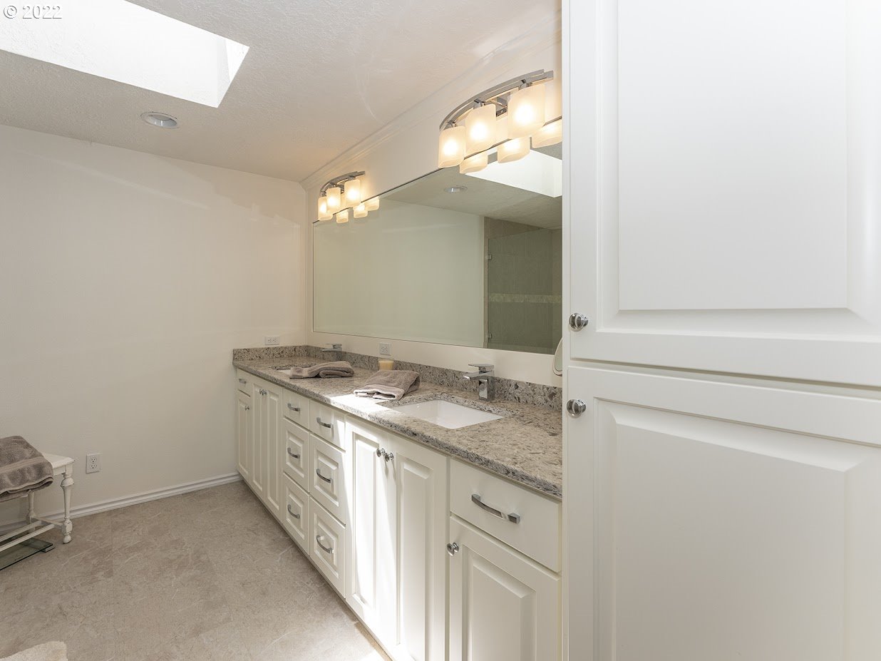6562 South Zimmerman Road Aurora, OR 97002 - Photo 23 of 31 a bathroom with a granite countertop sink and a mirror