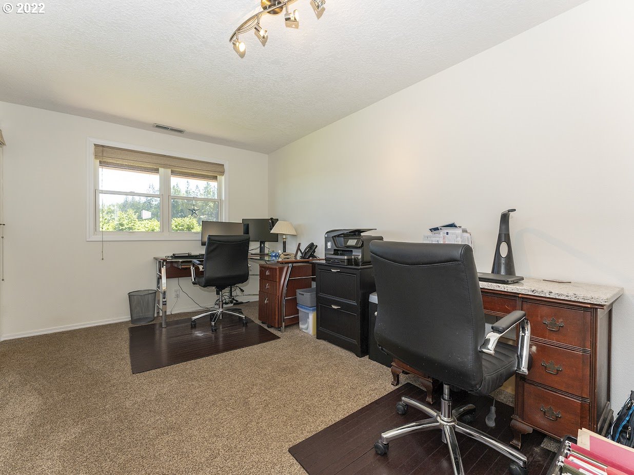 6562 South Zimmerman Road Aurora, OR 97002 - Photo 26 of 31 a view of a workspace with furniture and a window