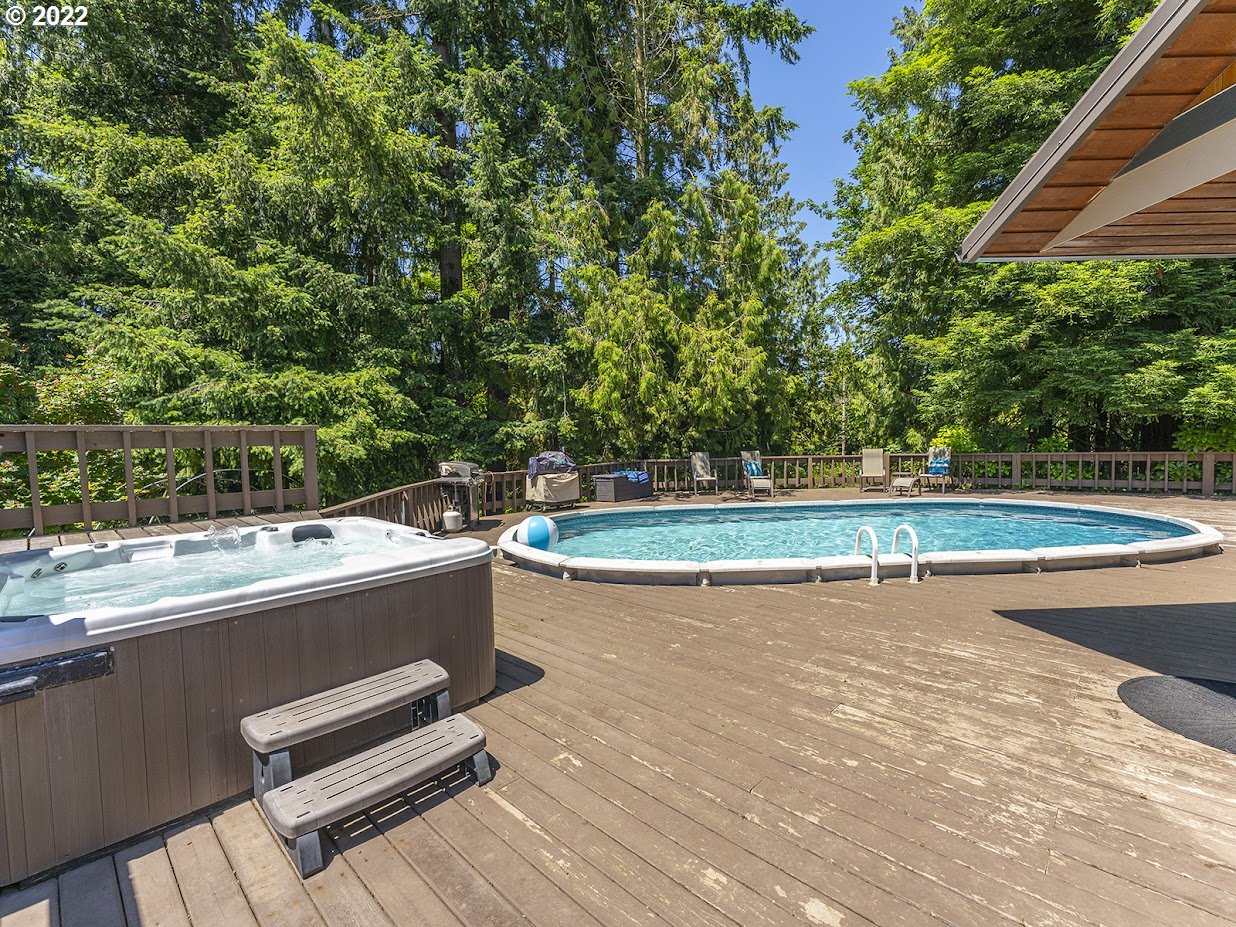 6562 South Zimmerman Road Aurora, OR 97002 - Photo 30 of 31 a view of a backyard with a table and chair