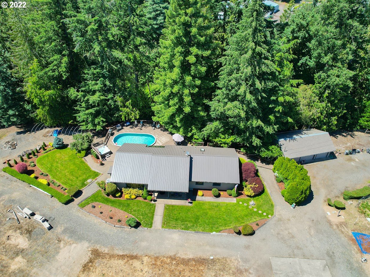 6562 South Zimmerman Road Aurora, OR 97002 - Photo 3 of 31 an aerial view of a house with a yard and greenery