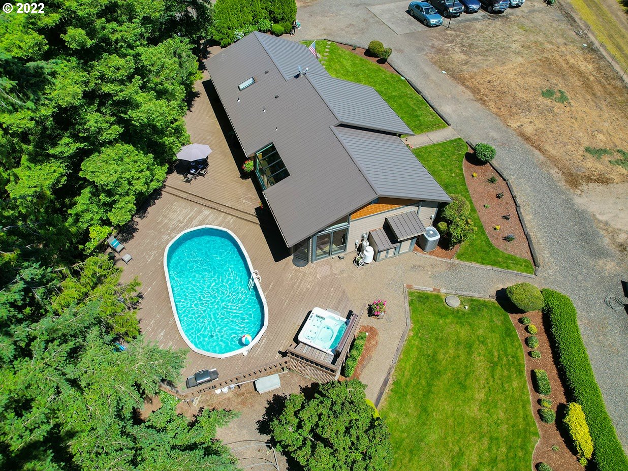 6562 South Zimmerman Road Aurora, OR 97002 - Photo 4 of 31 an aerial view of a house with a swimming pool
