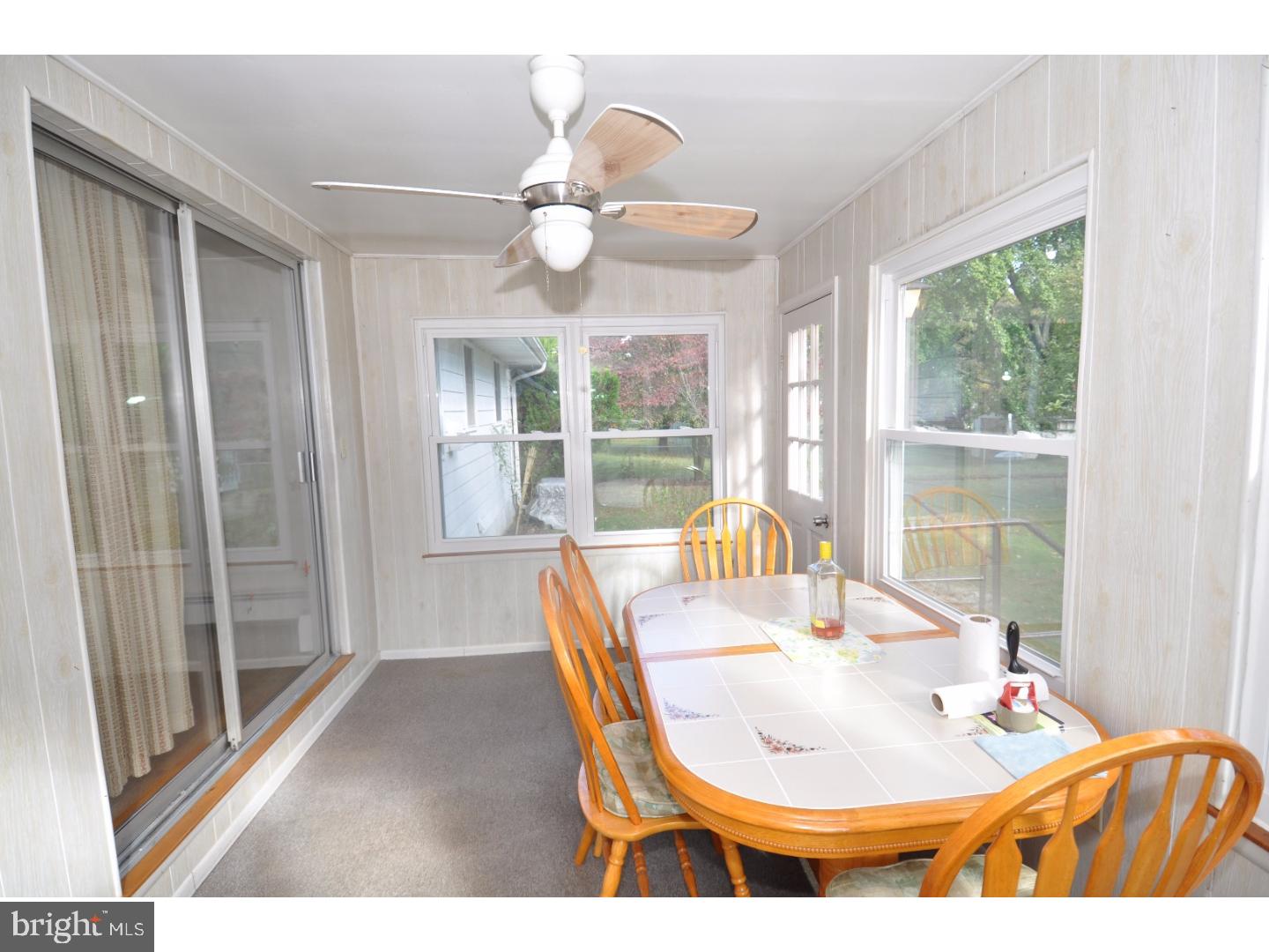 472 Station Road Roebling, NJ 08554 - Photo 15 of 25 a dining room with wooden floor and a large window