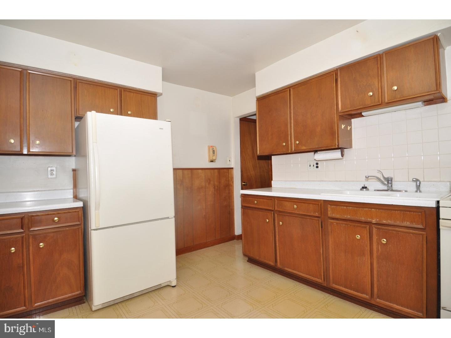 472 Station Road Roebling, NJ 08554 - Photo 4 of 25 a kitchen with sink a refrigerator and cabinets