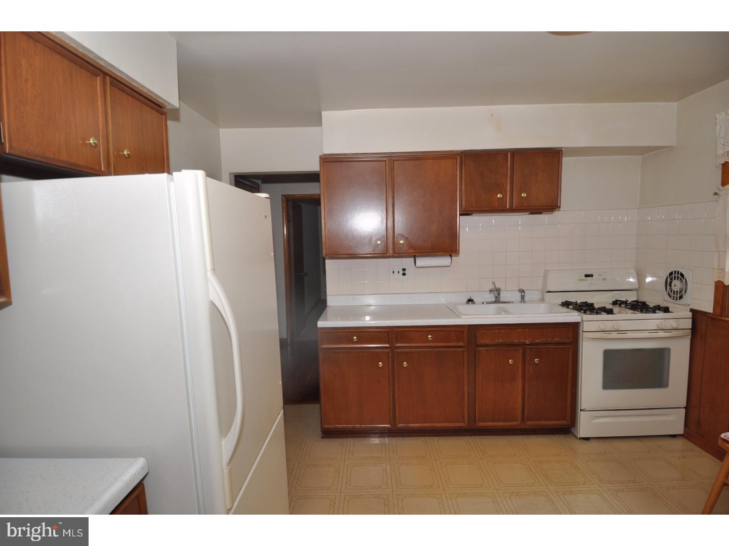 472 Station Road Roebling, NJ 08554 - Photo 5 of 25 a kitchen with stainless steel appliances a refrigerator and a stove