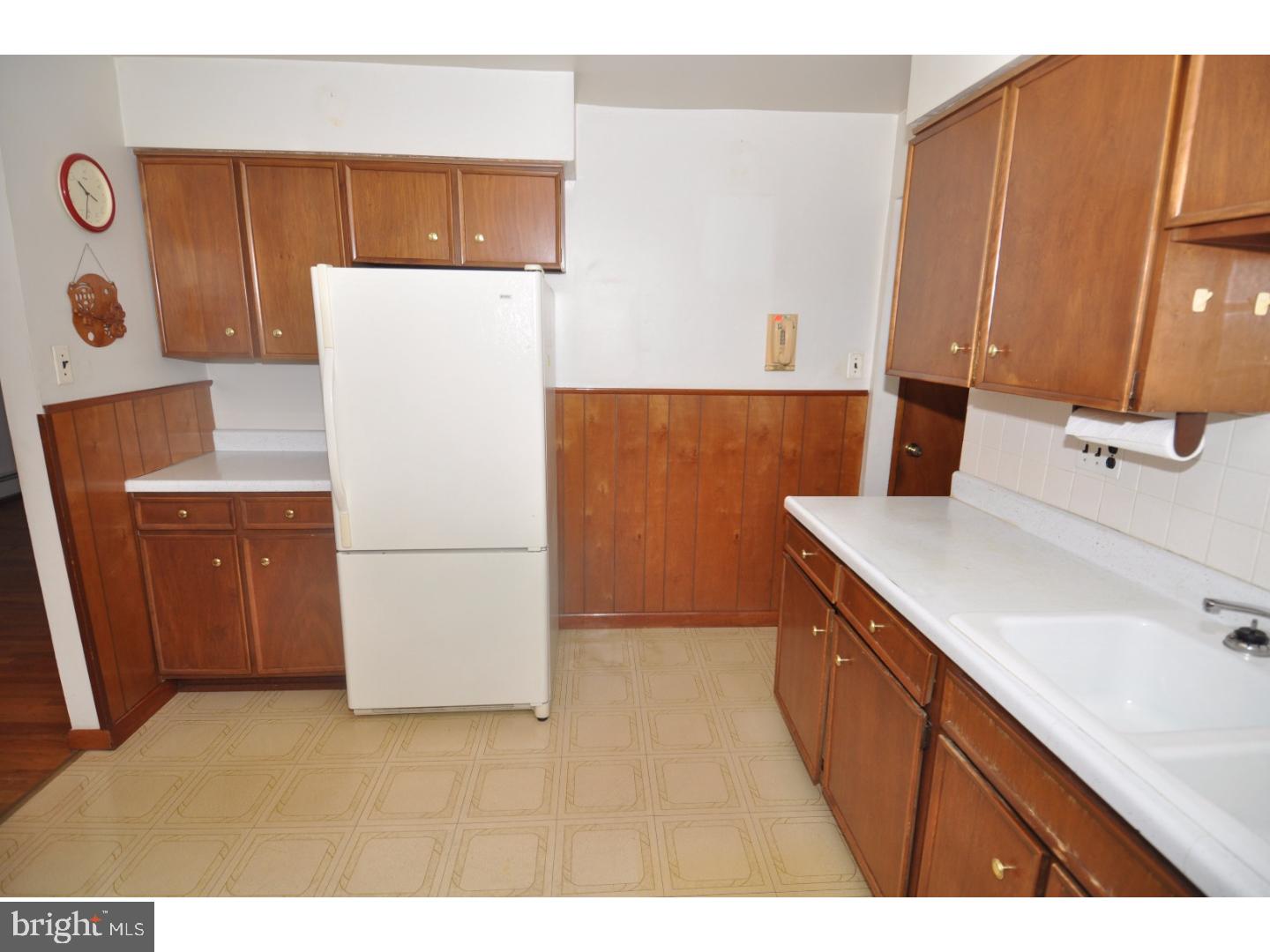 472 Station Road Roebling, NJ 08554 - Photo 7 of 25 a kitchen that has a sink a refrigerator and a stove