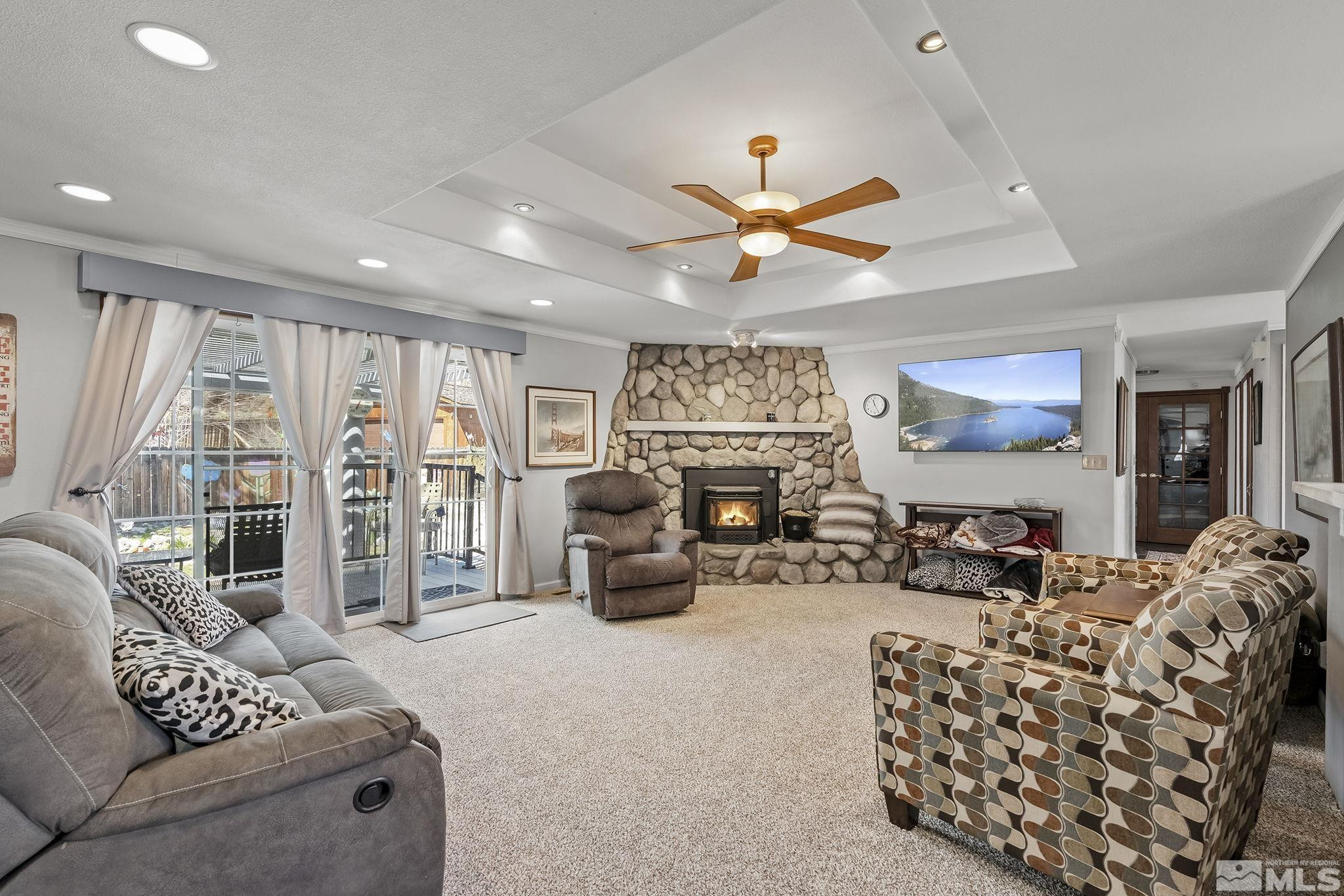 2 Lida Circle Carson City, NV 89706 - Photo 13 of 40 a living room with furniture ceiling fan and a large window