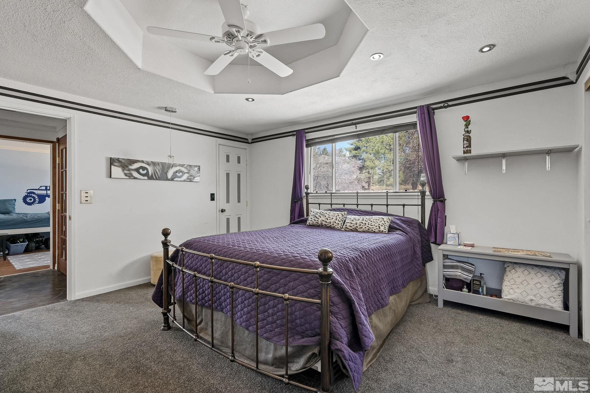 2 Lida Circle Carson City, NV 89706 - Photo 18 of 40 a bed sitting in a room next to a window