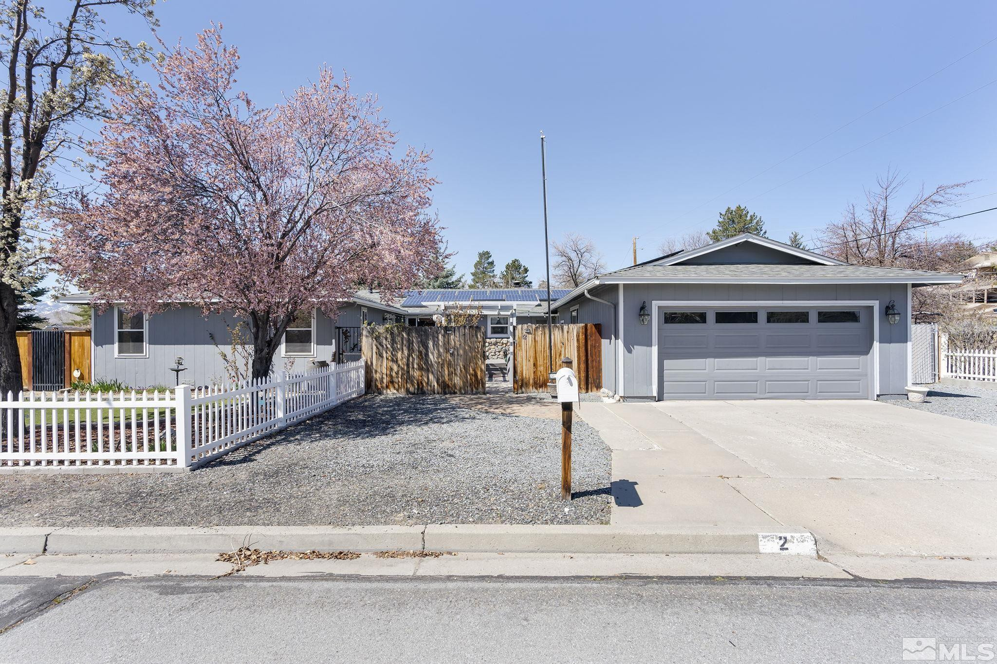2 Lida Circle Carson City, NV 89706 - Photo 2 of 40 a front view of a house with a yard and garage