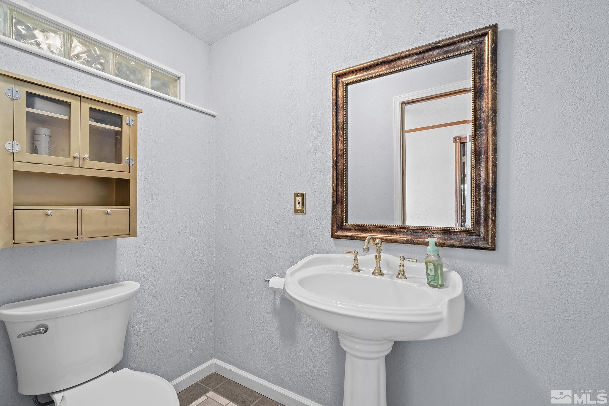 2 Lida Circle Carson City, NV 89706 - Photo 29 of 40 a bathroom with a toilet sink and mirror