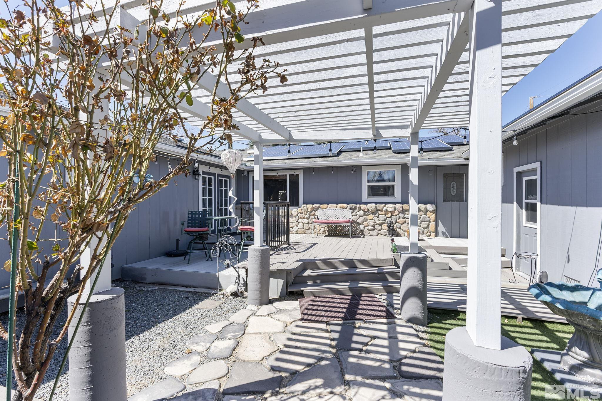 2 Lida Circle Carson City, NV 89706 - Photo 5 of 40 a view of a patio with couches table and chairs and potted plants