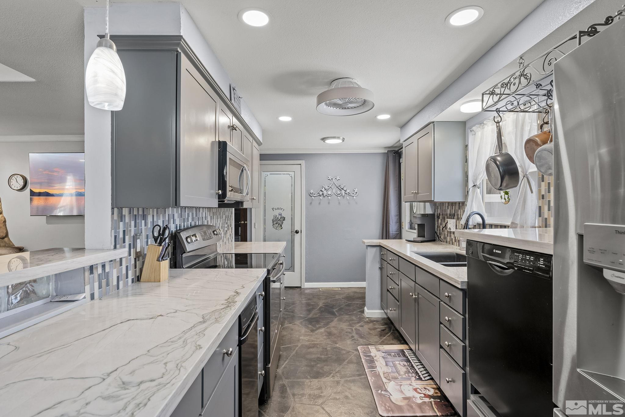 2 Lida Circle Carson City, NV 89706 - Photo 10 of 40 a kitchen with stainless steel appliances granite countertop a sink and stove