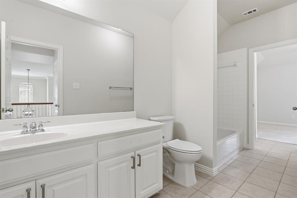 559 Reed Drive Fate, TX 75087 - Photo 32 of 40 jack and jill upstairs bathroom
