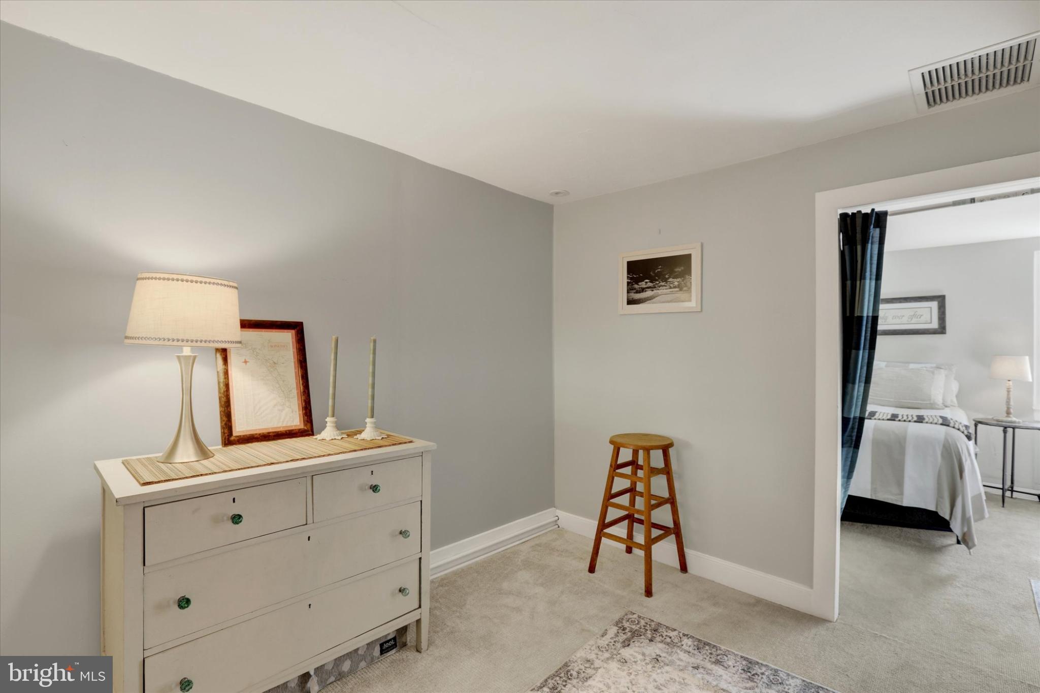 49 Old Mill Road New Hope, PA 18938 - Photo 18 of 50 Serene bedroom corner with soft lighting.