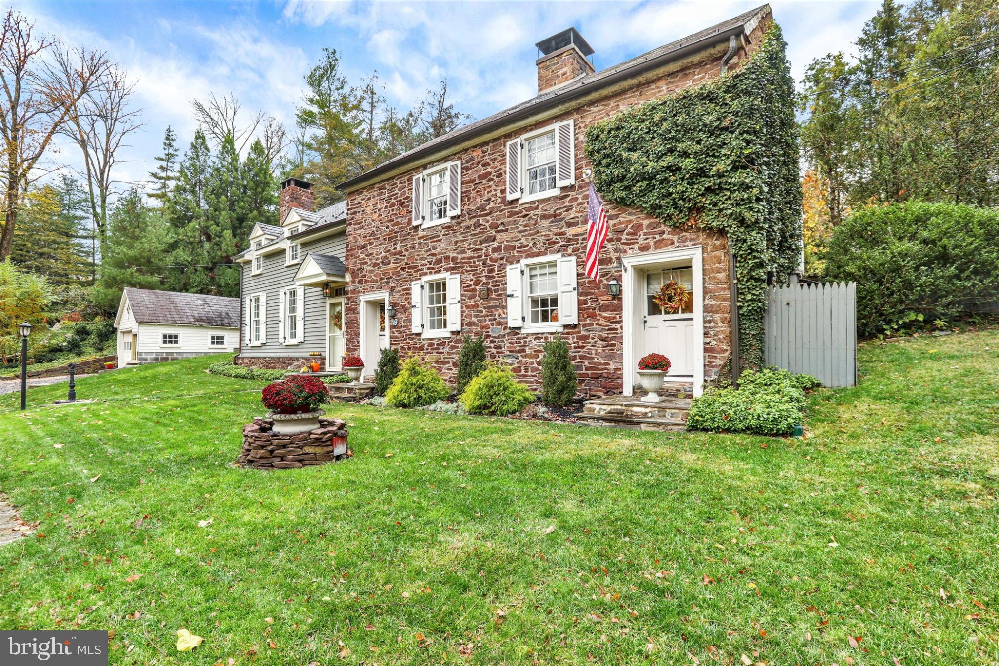 49 Old Mill Road New Hope, PA 18938 - Photo 3 of 50 Charming stone home with lush greenery.