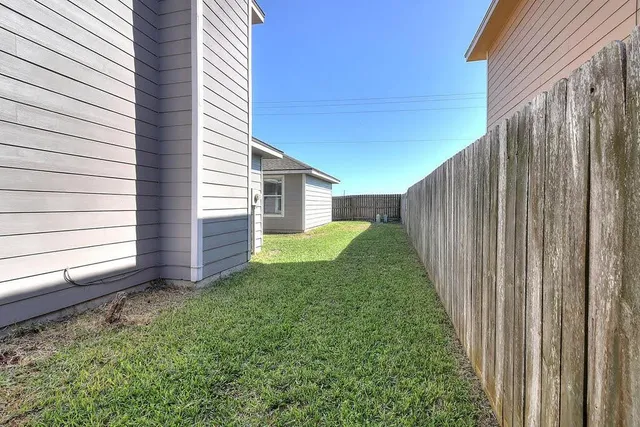 a view of a back yard of the house