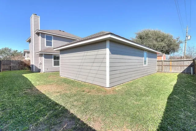 a view of a backyard of the house