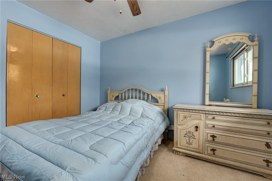 13617 Sheldon Road Cleveland, OH 44130 - Photo 19 of 36 Bedroom with light colored carpet, a closet, and ceiling fan