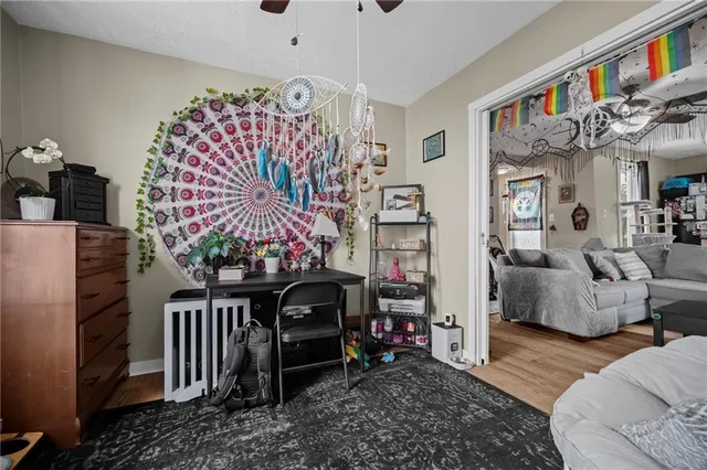 a bedroom with furniture and wooden floor
