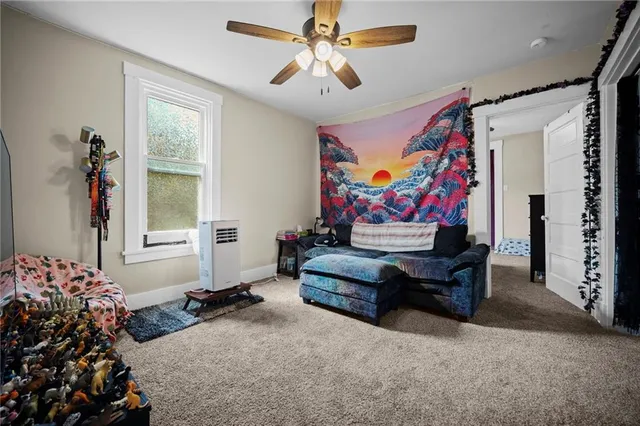 a living room with furniture and flowers