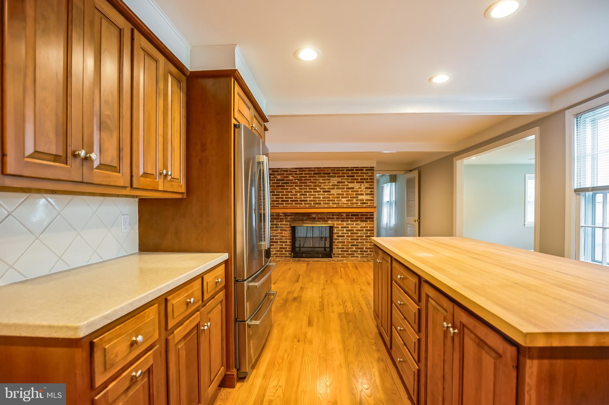 121 Rockingham Road Cherry Hill, NJ 08034 - Photo 14 of 33 a spacious bathroom with a granite countertop sink and a large mirror