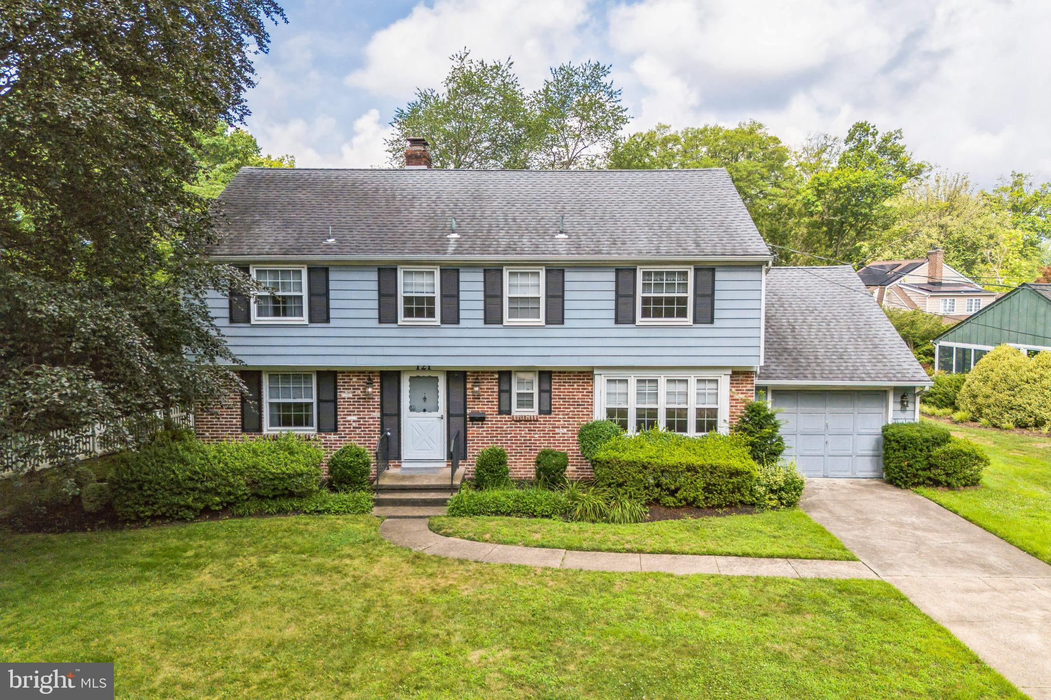 121 Rockingham Road Cherry Hill, NJ 08034 - Photo 29 of 33 a front view of a house with a garden and plants