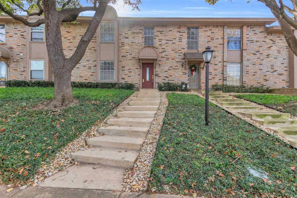 7610 Highmont Street Dallas, TX 75230 - Photo 2 of 37 a front view of a house with garden