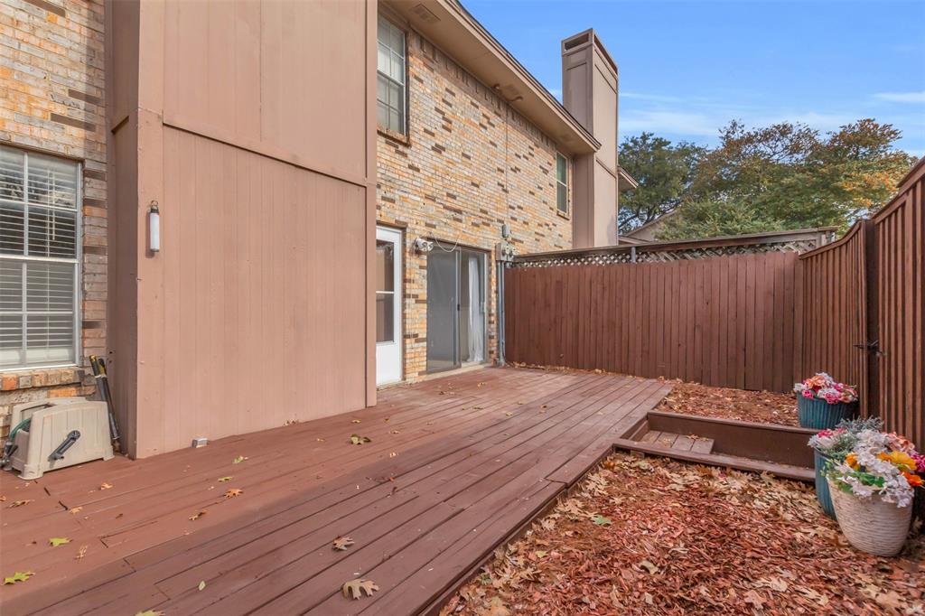 7610 Highmont Street Dallas, TX 75230 - Photo 21 of 37 a view of a backyard with sitting area