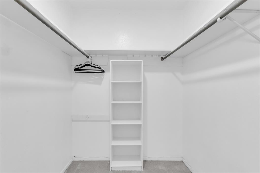 7610 Highmont Street Dallas, TX 75230 - Photo 29 of 37 a view of an empty walk in closet