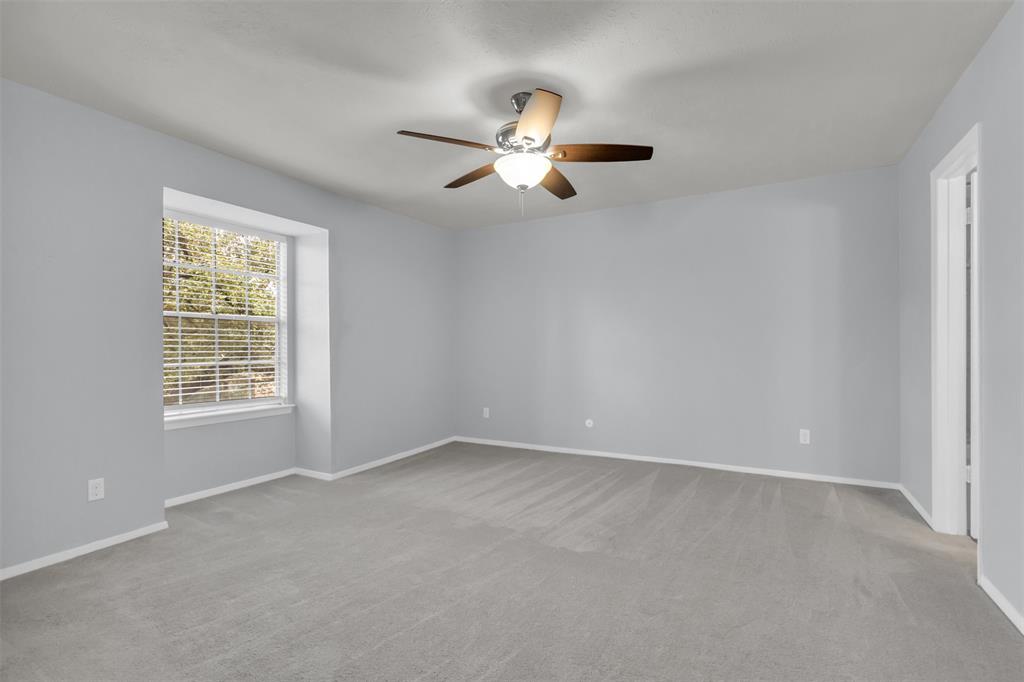 7610 Highmont Street Dallas, TX 75230 - Photo 34 of 37 wooden floor in an empty room with a window