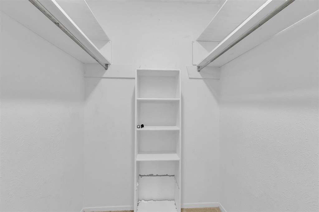 7610 Highmont Street Dallas, TX 75230 - Photo 35 of 37 a view of an empty walk in closet